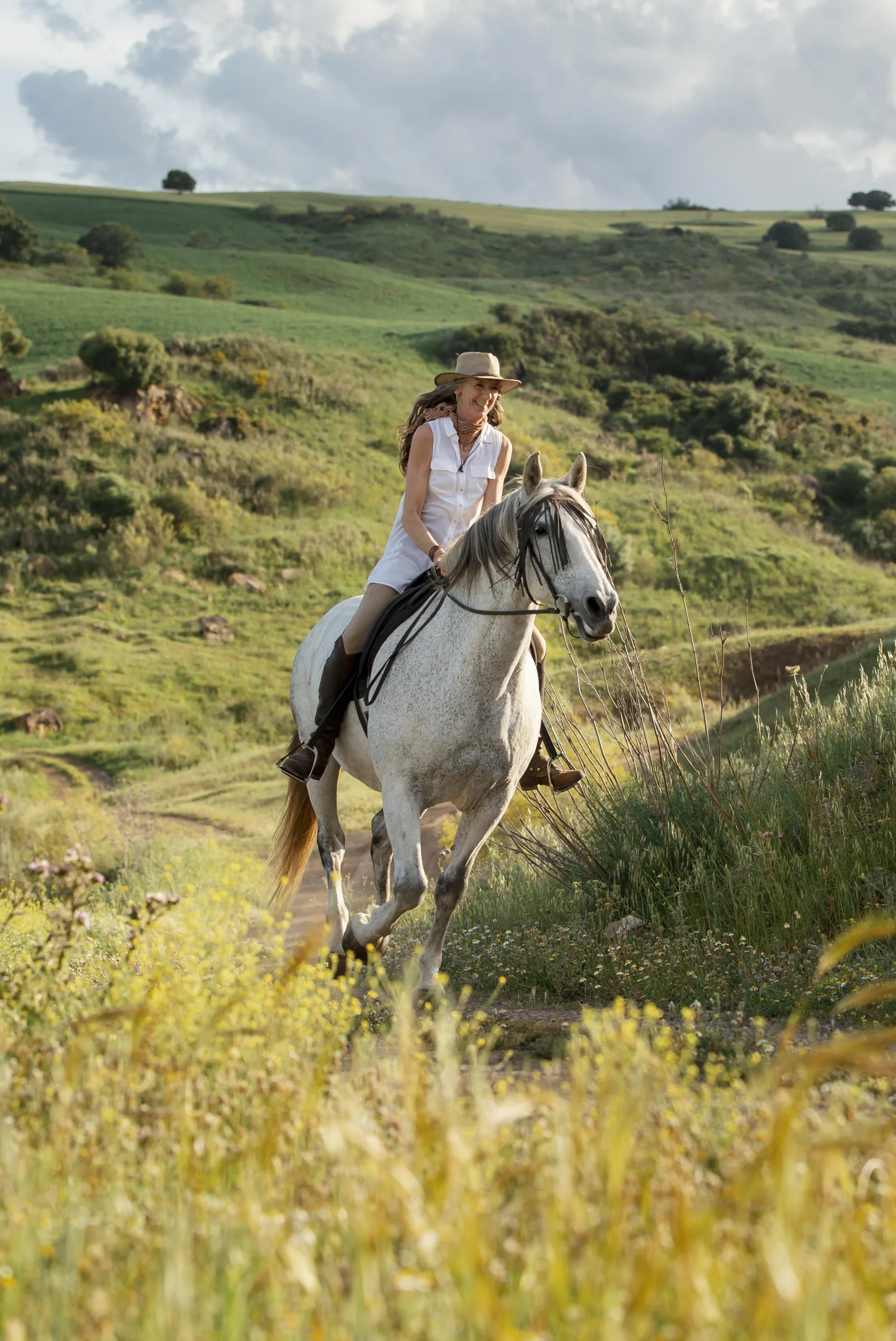 female-farmer-horseback-riding-outdoors-nature